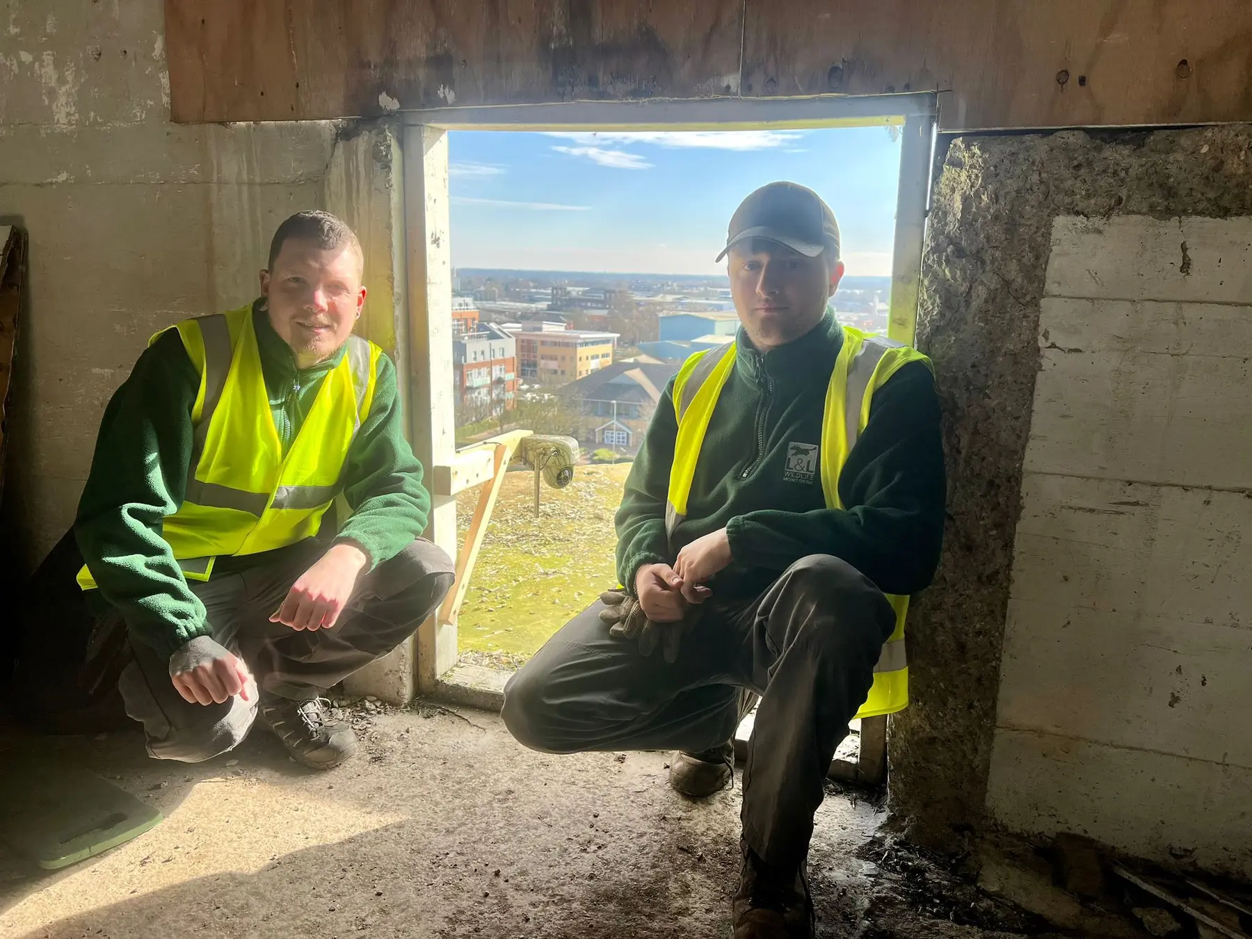 L&L Wildlife Monitoring team working inside a building during a site visit
